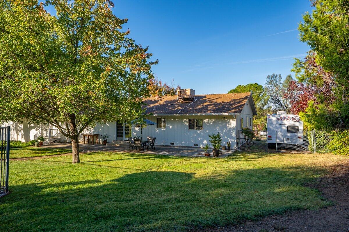 12269 Dry Creek Road Bella Vista, CA 96008 - Photo 71 of 74 a view of a big yard with palm trees