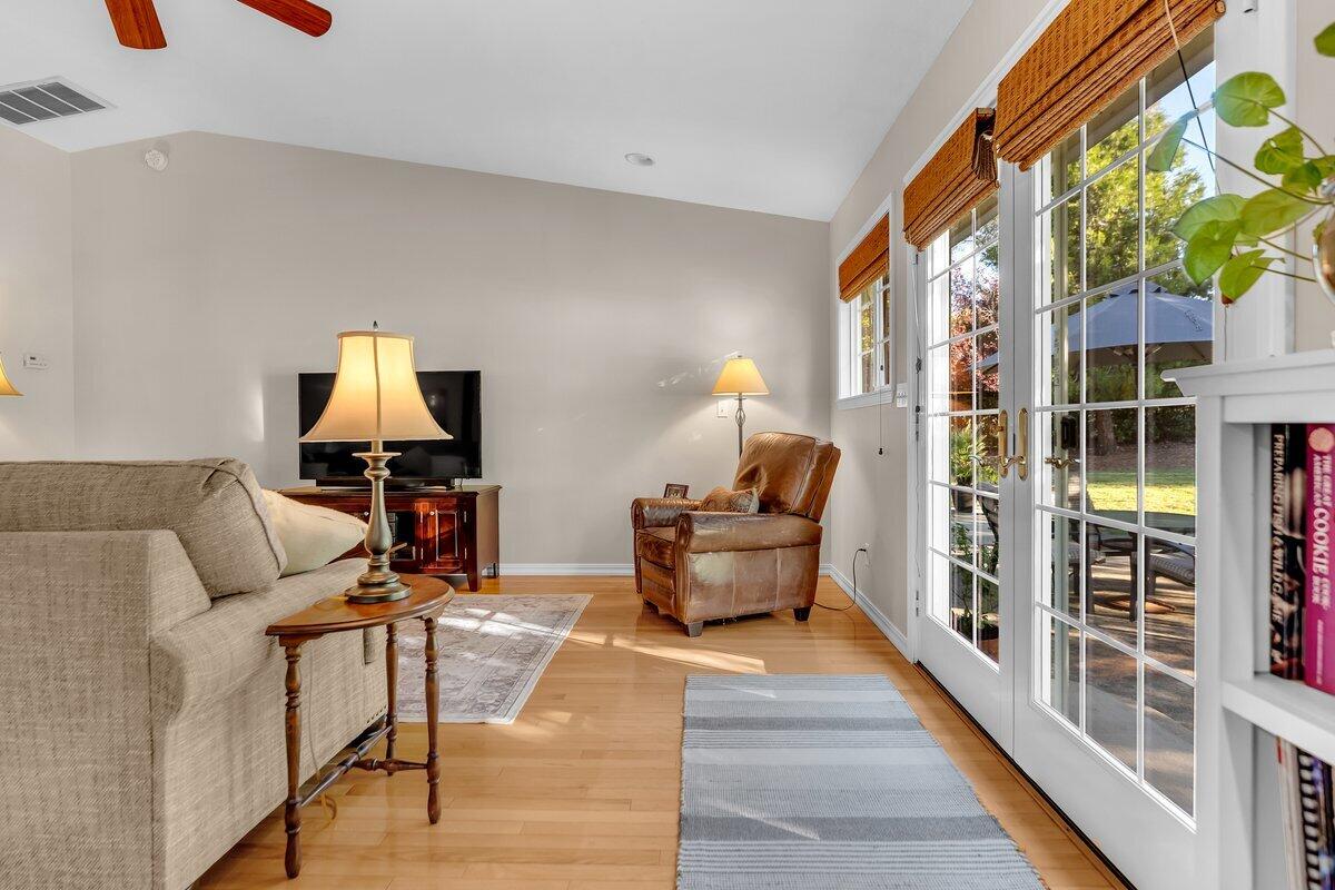 12269 Dry Creek Road Bella Vista, CA 96008 - Photo 10 of 74 a living room with furniture and a wooden floor