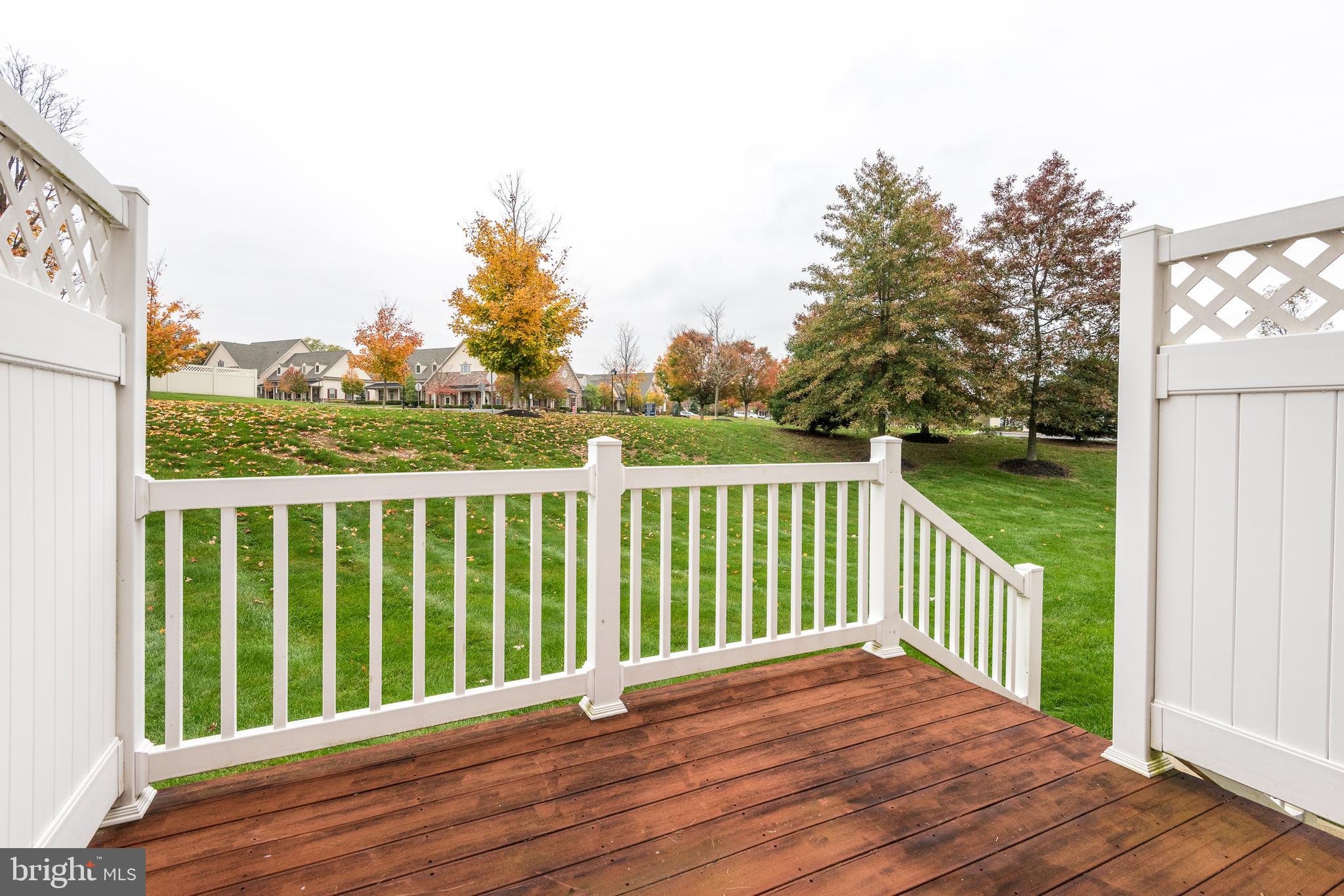 3233 Meadow View Circle, Unit 155 Furlong, PA 18925 - Photo 16 of 36 a view of balcony with wooden floor and fence