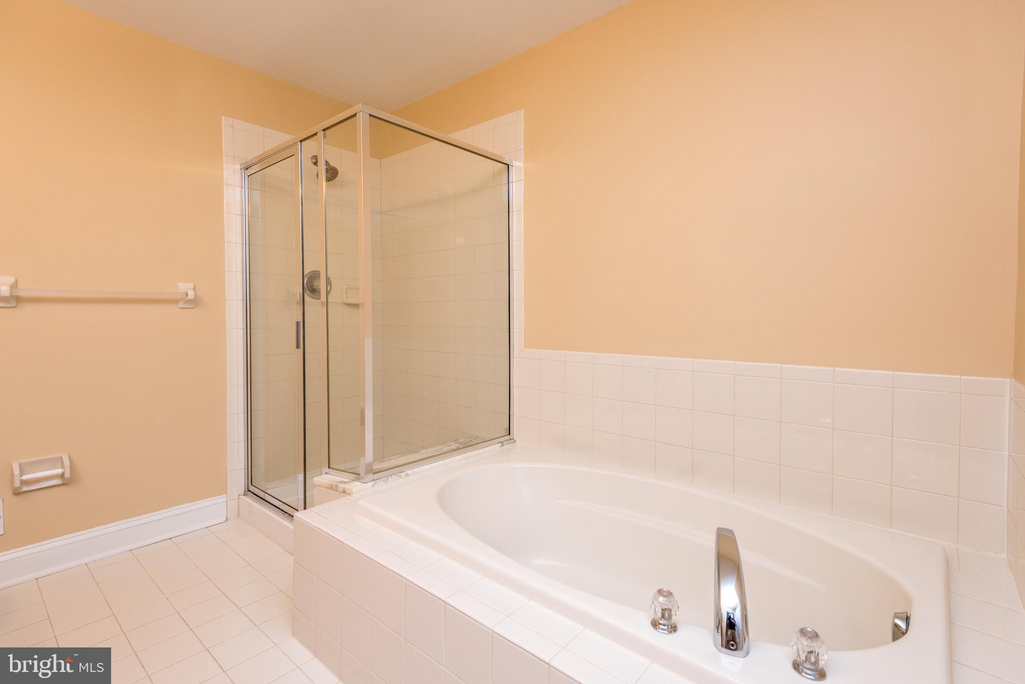 3233 Meadow View Circle, Unit 155 Furlong, PA 18925 - Photo 22 of 36 a bathroom with a bathtub and a shower