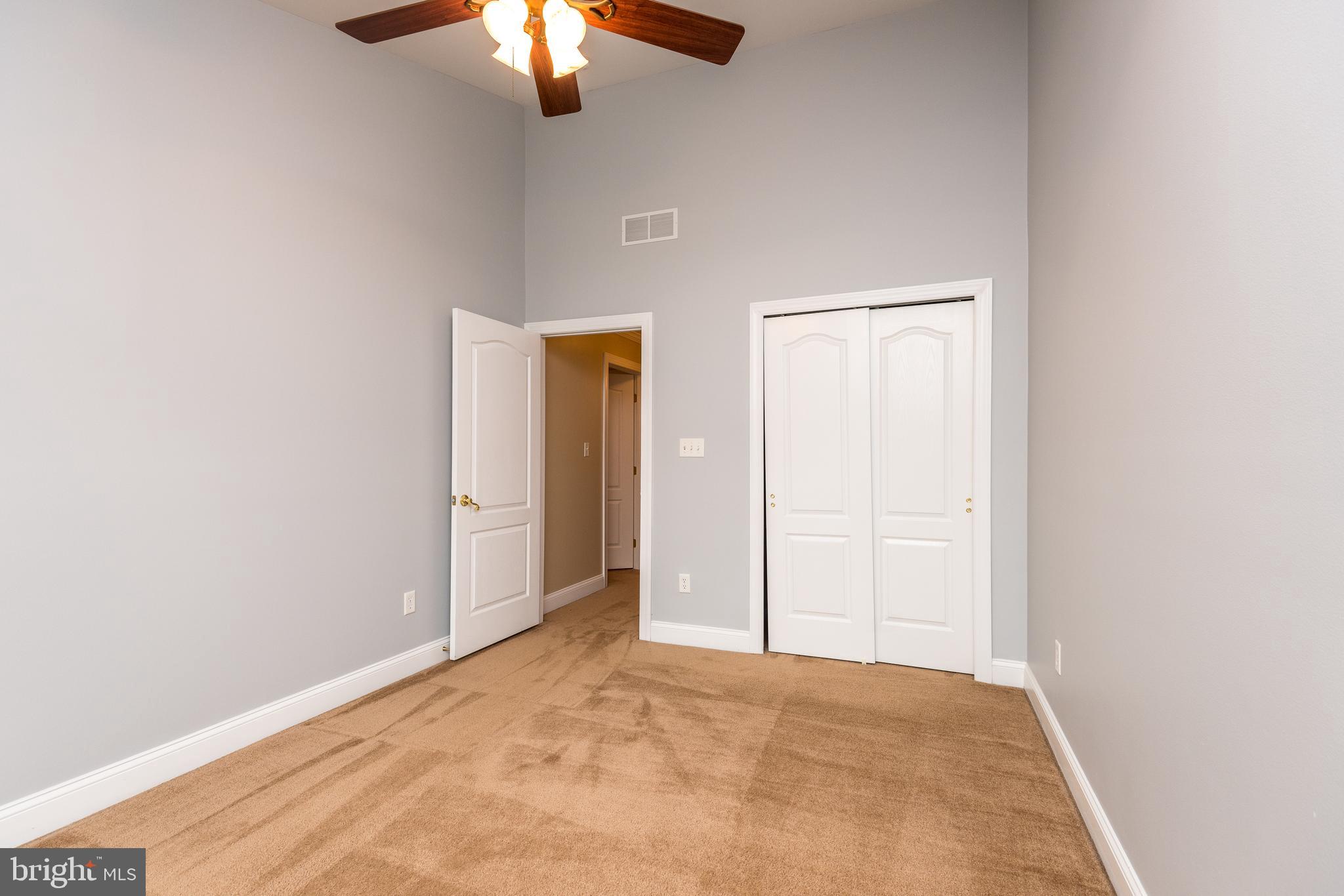 3233 Meadow View Circle, Unit 155 Furlong, PA 18925 - Photo 24 of 36 an empty room with fan