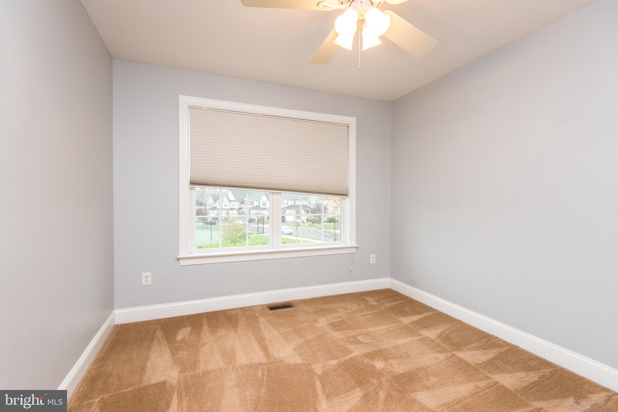 3233 Meadow View Circle, Unit 155 Furlong, PA 18925 - Photo 25 of 36 an empty room with a window
