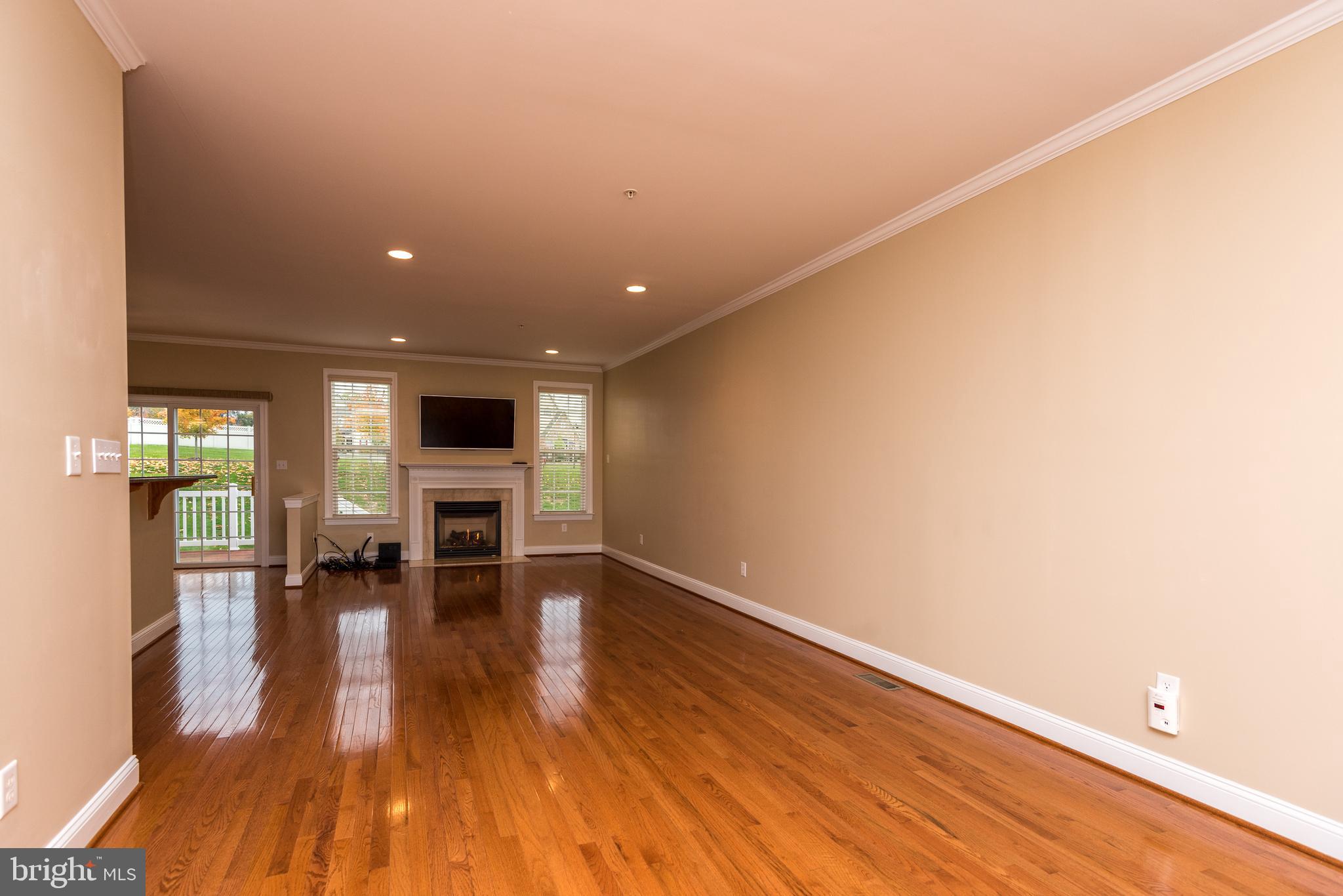 3233 Meadow View Circle, Unit 155 Furlong, PA 18925 - Photo 3 of 36 a view of empty room with wooden floor