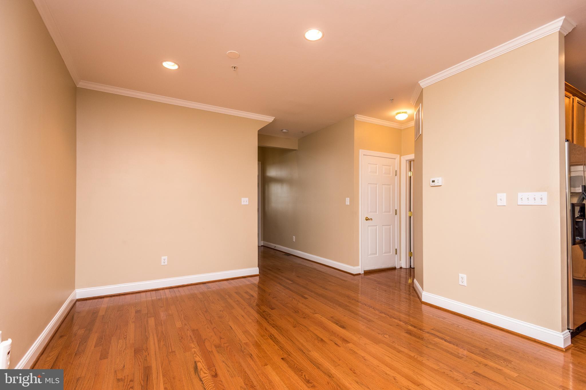 3233 Meadow View Circle, Unit 155 Furlong, PA 18925 - Photo 4 of 36 a view of an empty room with wooden floor