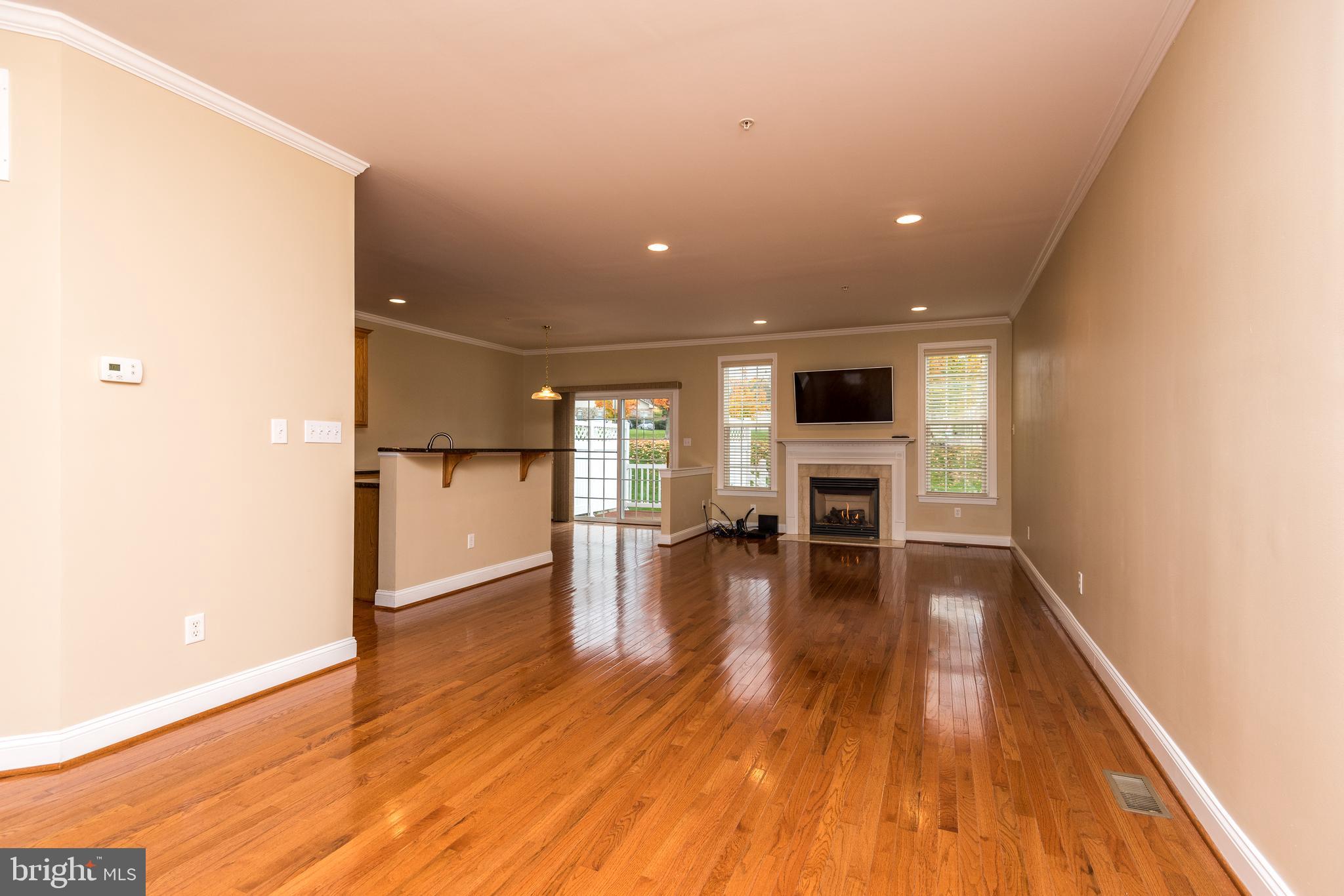 3233 Meadow View Circle, Unit 155 Furlong, PA 18925 - Photo 5 of 36 a view of a livingroom with wooden floor