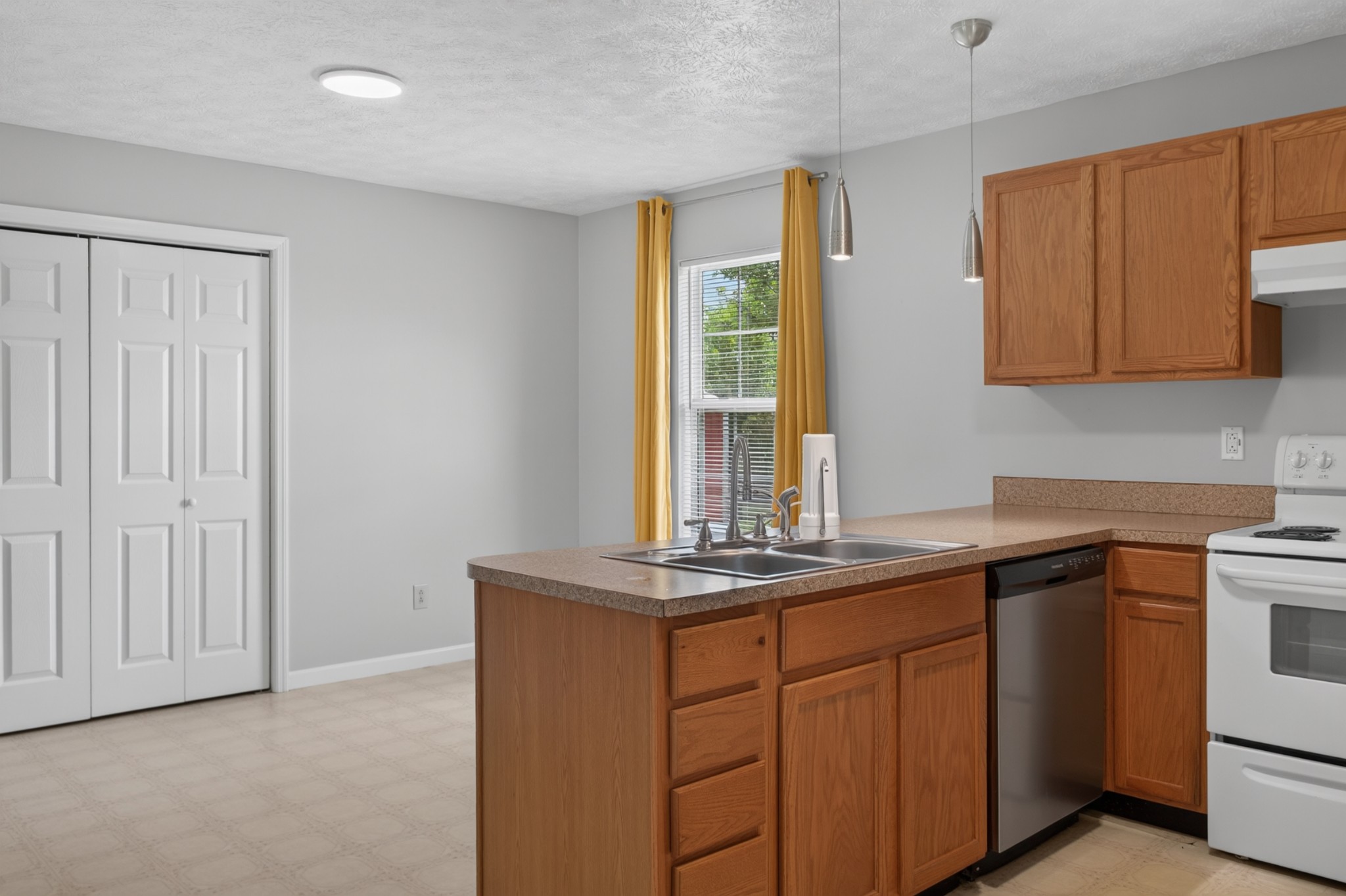 618 Lear Road Portland, TN 37148 - Photo 17 of 29 a kitchen with stainless steel appliances granite countertop a sink stove and cabinets