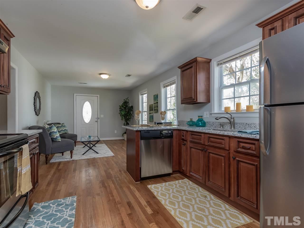 400 Colleton Road Raleigh, NC 27610 - Photo 10 of 23 A view through the kitchen to the living/dining area