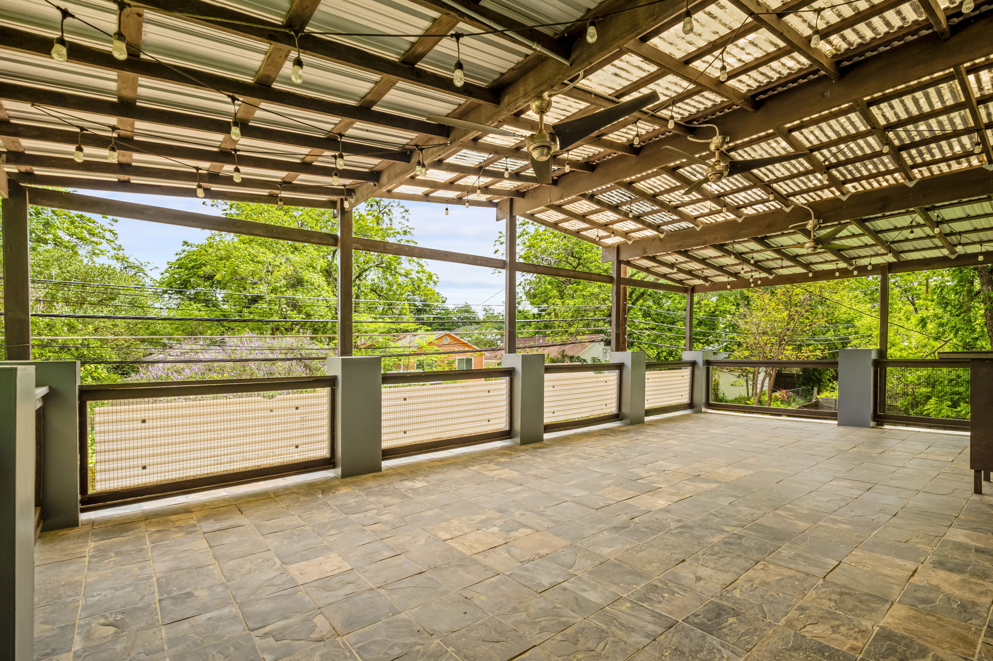 2202 Garden Street, Unit B Austin, TX 78702 - Photo 5 of 29 Rooftop patio with entrance from hallway and one of the bedrooms