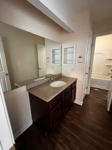 a bathroom with a sink and a mirror