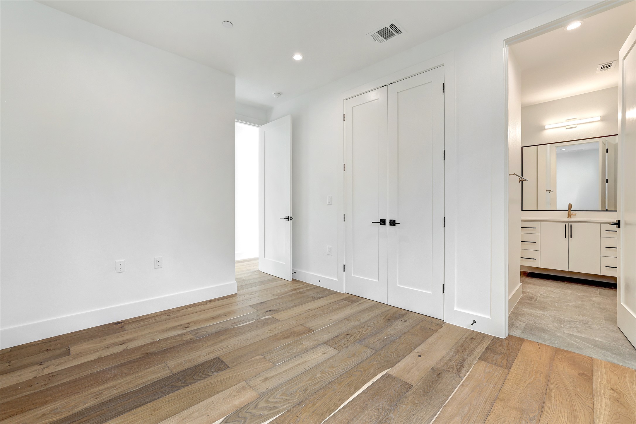 3208 Clawson Road, Unit 5A Austin, TX 78704 - Photo 26 of 34 Unfurnished bedroom with light wood-style flooring, recessed lighting, and a closet