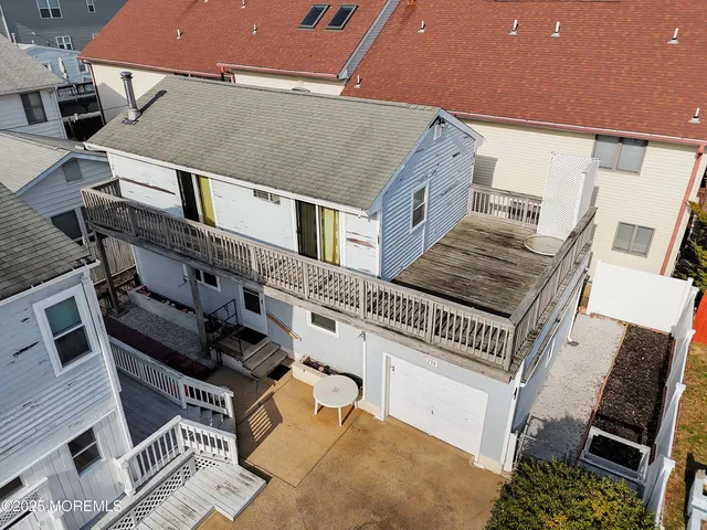 an aerial view of a house with a ocean view