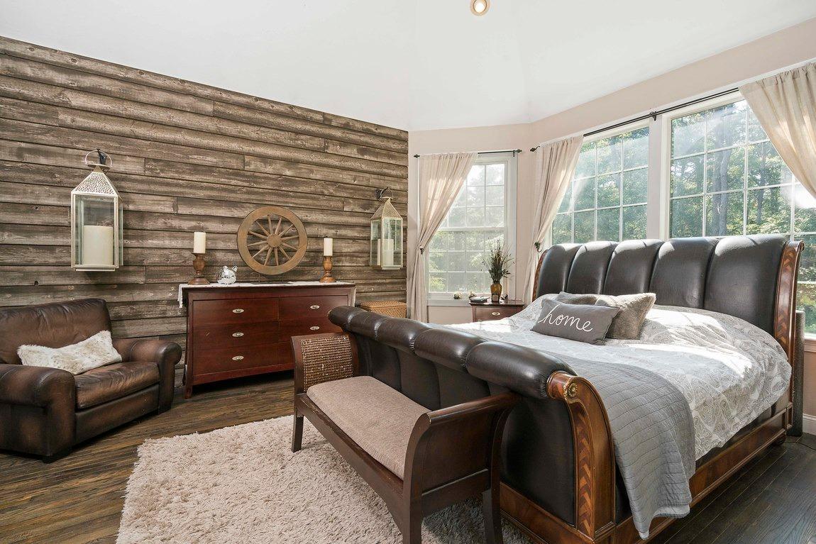 89 Old Hyannis Road Yarmouth Port, MA 02675 - Photo 16 of 35 a bedroom with a bed and a couch next to a window