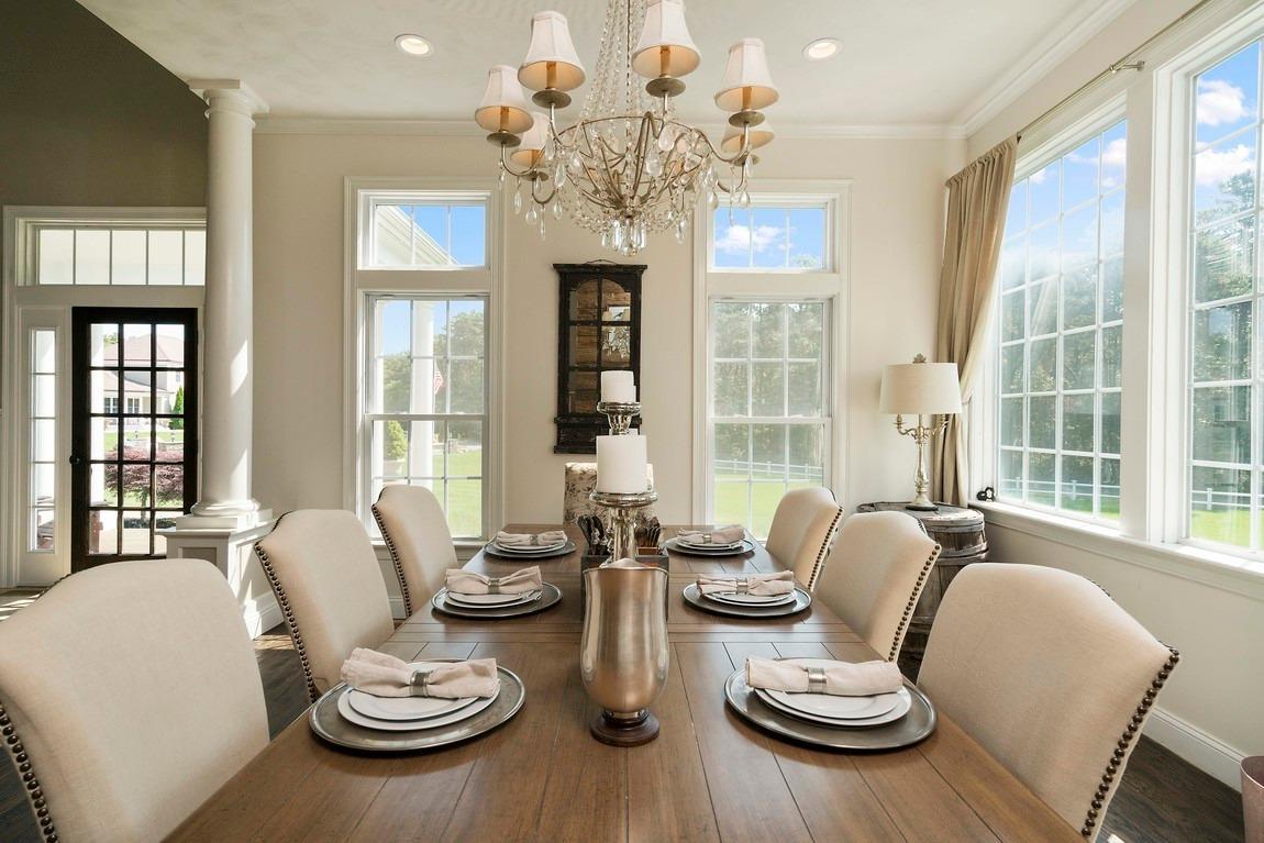 89 Old Hyannis Road Yarmouth Port, MA 02675 - Photo 20 of 35 a dining room with furniture a large window and chandelier