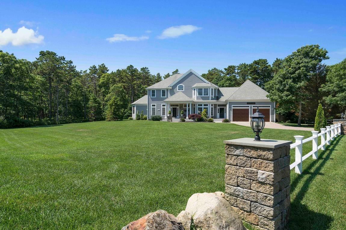 89 Old Hyannis Road Yarmouth Port, MA 02675 - Photo 2 of 35 a front view of a house with a yard