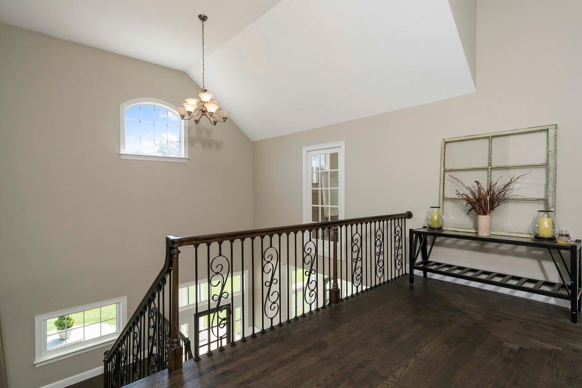 89 Old Hyannis Road Yarmouth Port, MA 02675 - Photo 22 of 35 a view of a balcony with furniture and wooden floor