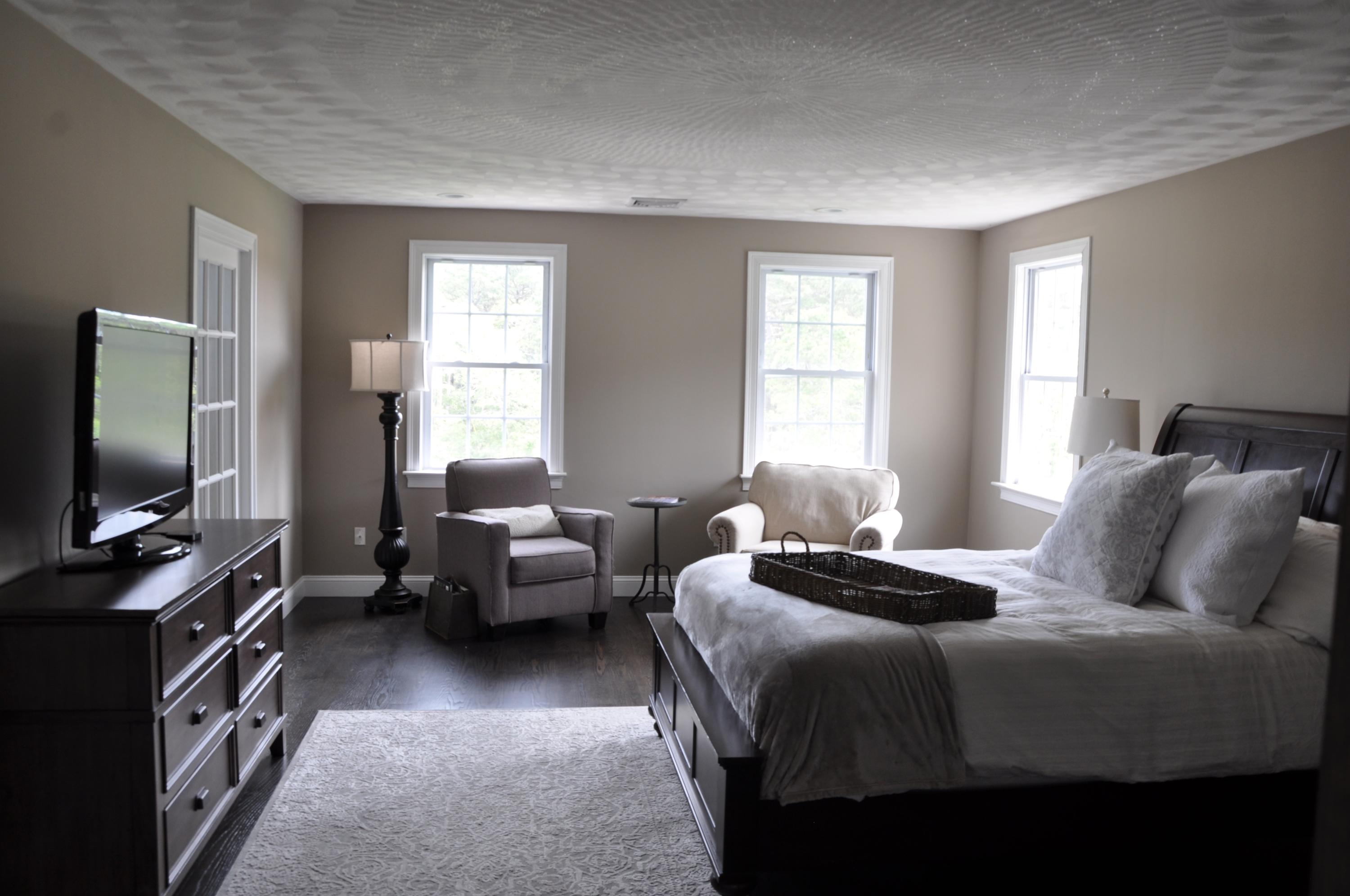 89 Old Hyannis Road Yarmouth Port, MA 02675 - Photo 23 of 35 a bedroom with a bed and a flat screen tv