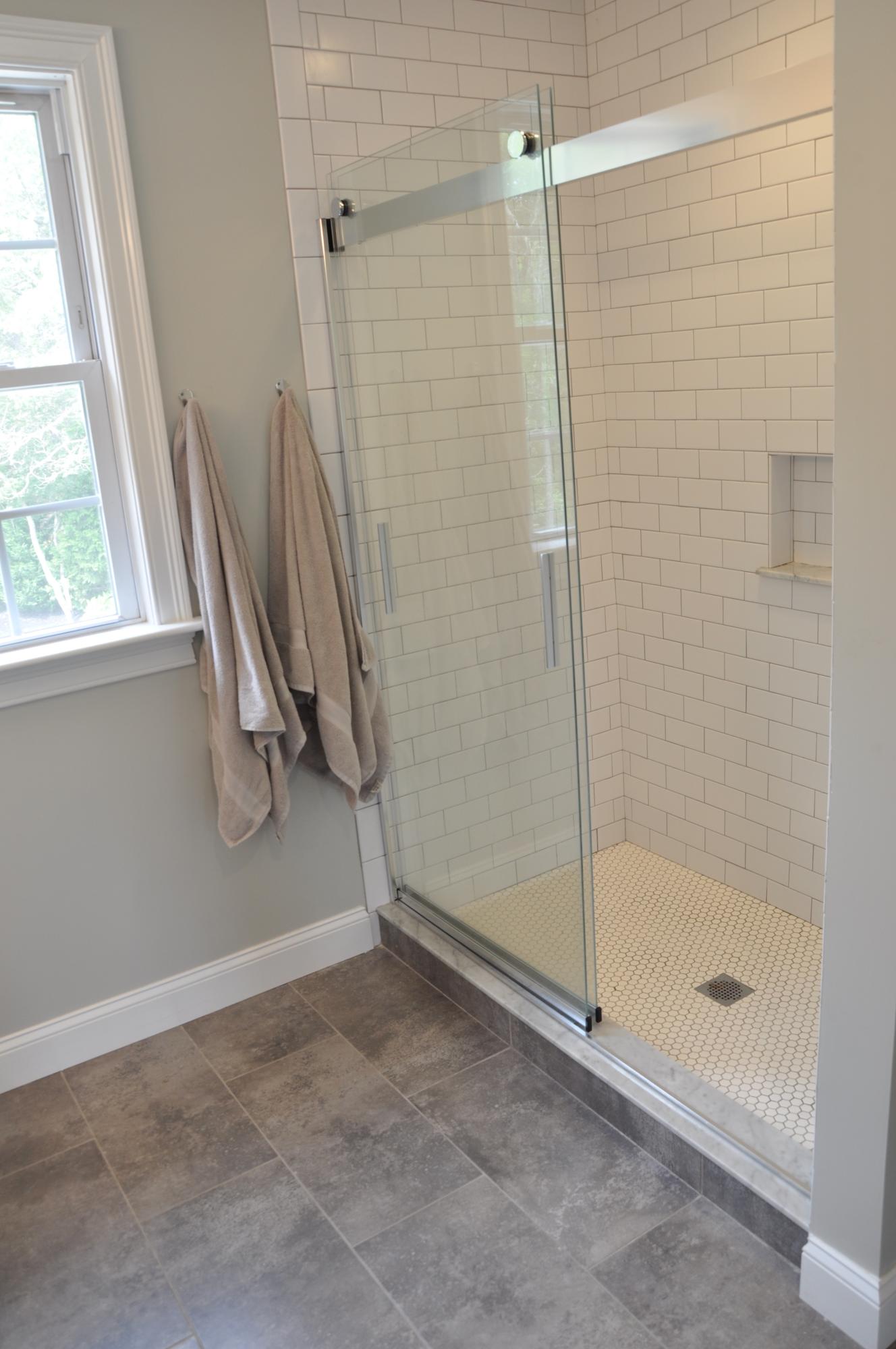 89 Old Hyannis Road Yarmouth Port, MA 02675 - Photo 26 of 35 a bathroom with a glass shower door
