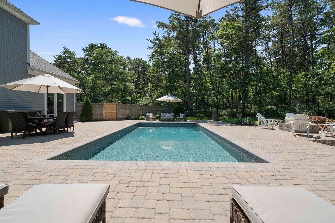 89 Old Hyannis Road Yarmouth Port, MA 02675 - Photo 29 of 35 a house view with a swimming pool