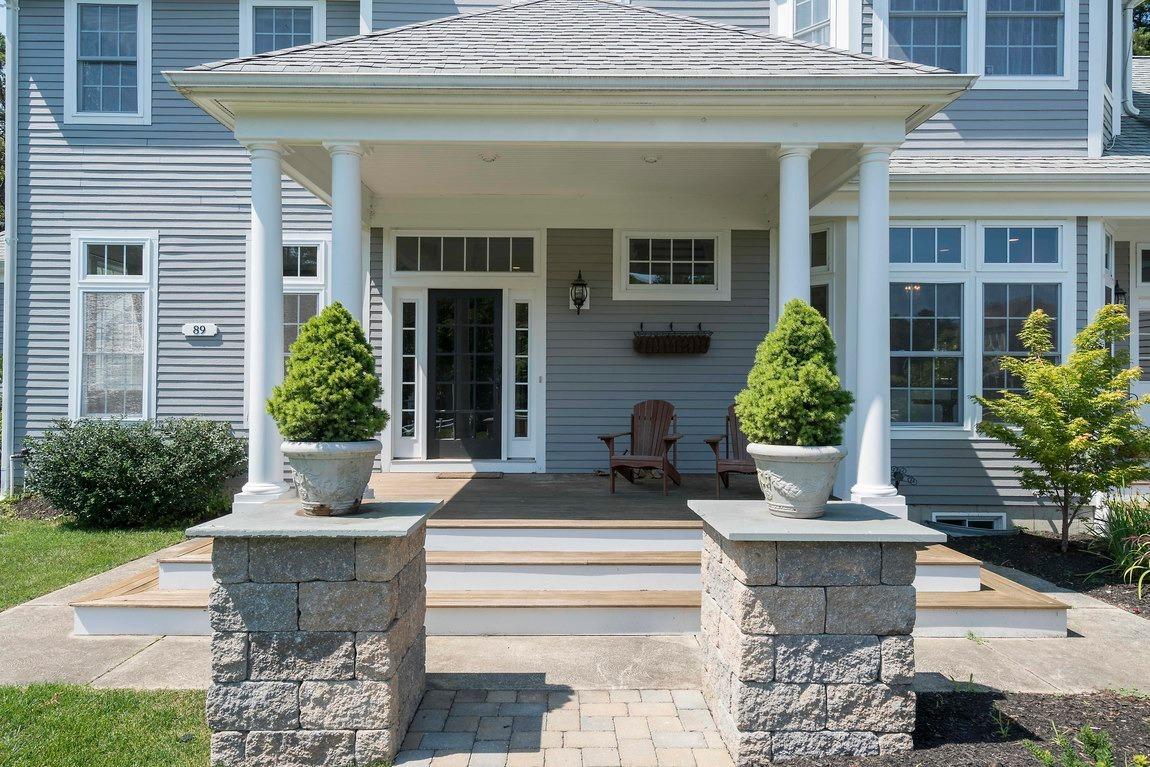 89 Old Hyannis Road Yarmouth Port, MA 02675 - Photo 4 of 35 a front view of a house with potted plants