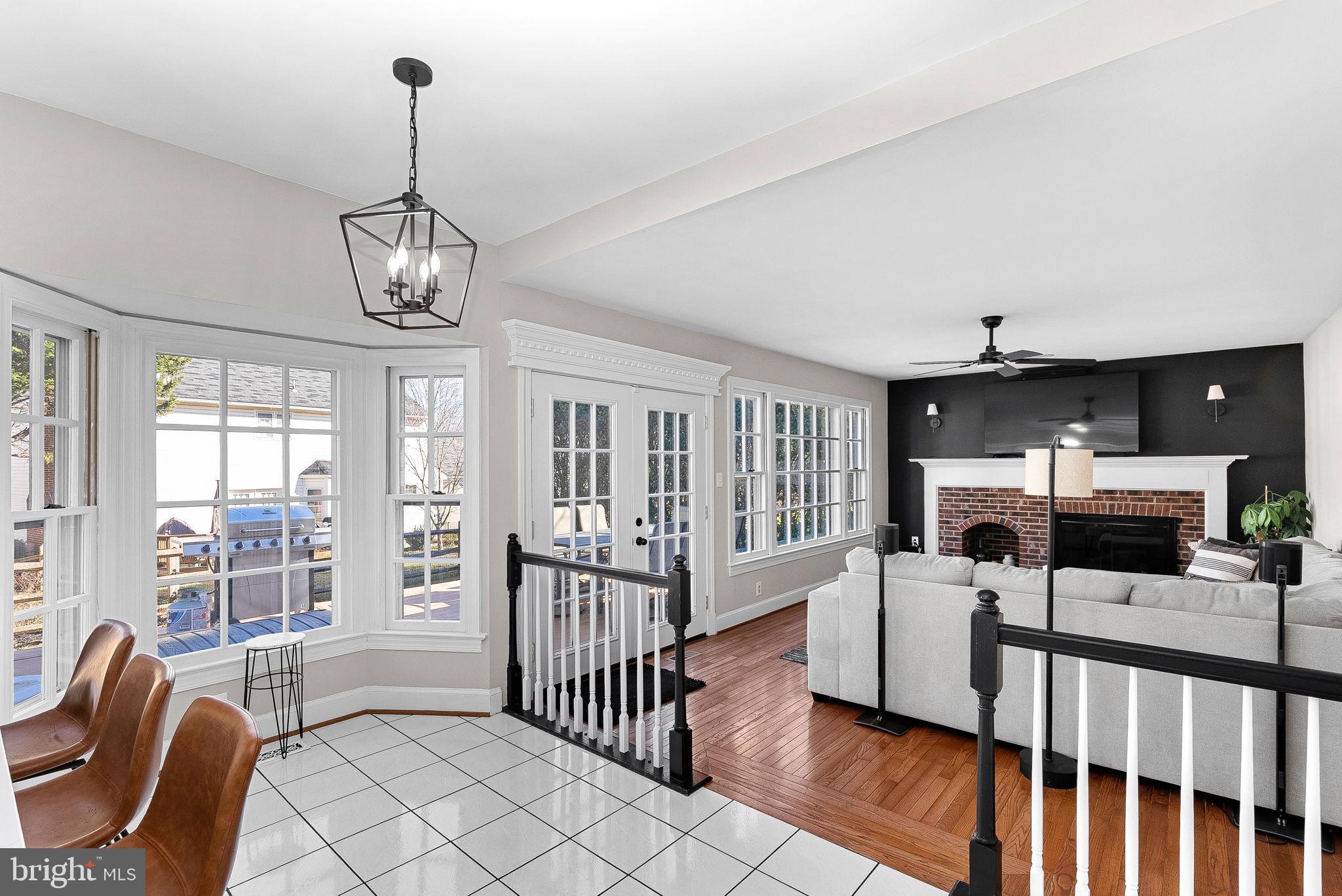 9440 Flowerden Lane Manassas, VA 20110 - Photo 18 of 66 a view of a livingroom with furniture wooden floor and windows