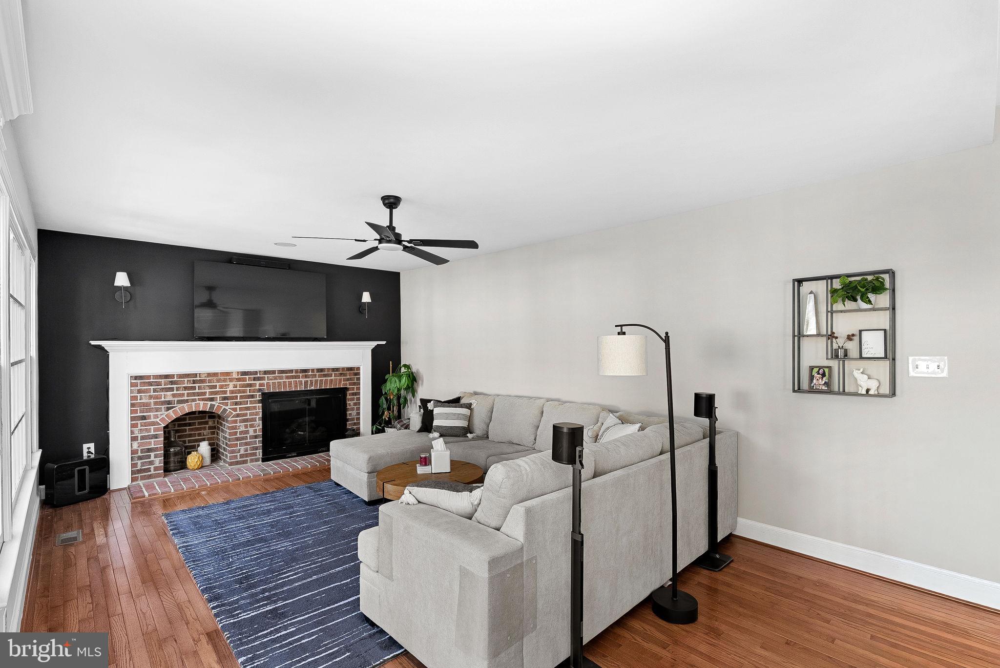 9440 Flowerden Lane Manassas, VA 20110 - Photo 20 of 66 a living room with furniture and a fireplace