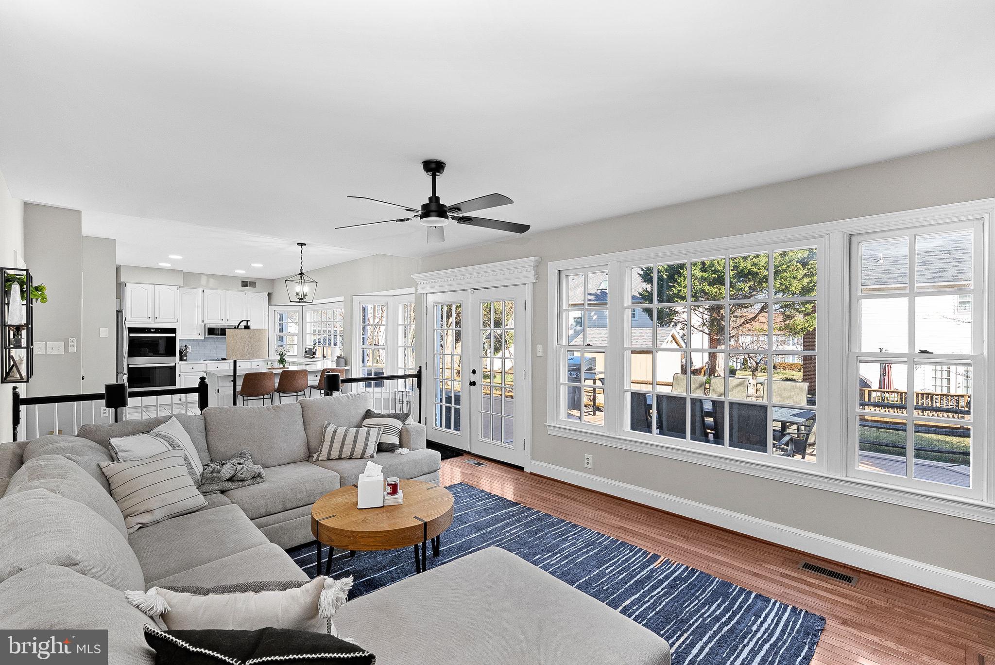 9440 Flowerden Lane Manassas, VA 20110 - Photo 21 of 66 a living room with furniture and a large window