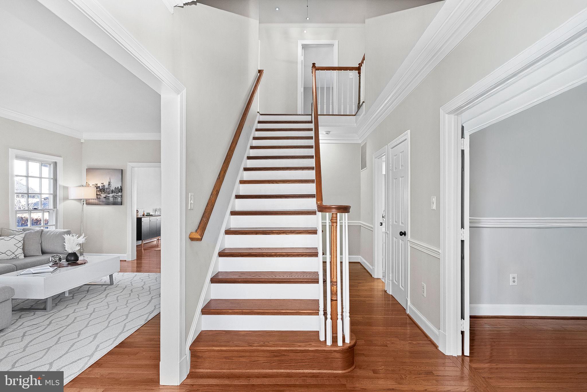 9440 Flowerden Lane Manassas, VA 20110 - Photo 25 of 66 a view of a hallway with wooden floor and entryway