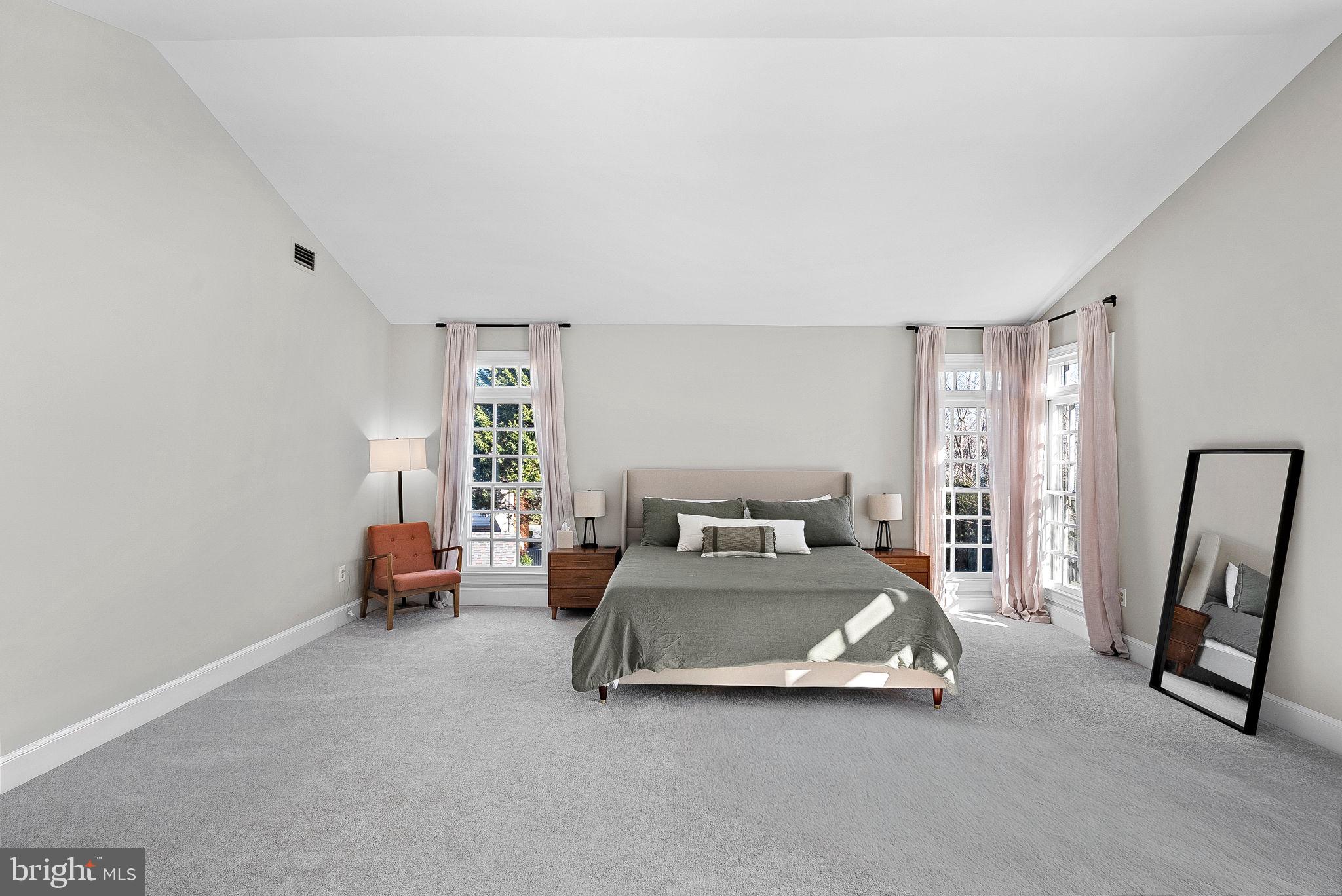 9440 Flowerden Lane Manassas, VA 20110 - Photo 28 of 66 a large bedroom with a bed and a window