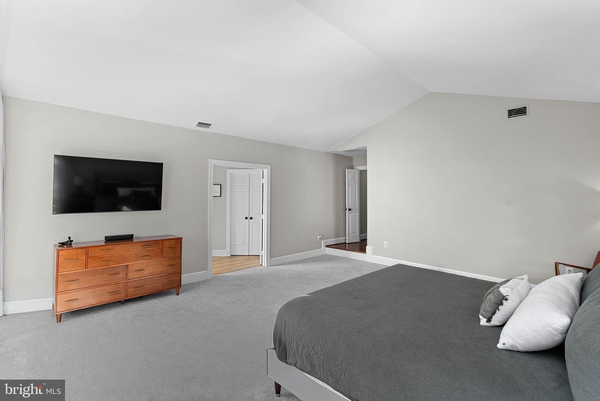 9440 Flowerden Lane Manassas, VA 20110 - Photo 30 of 66 a living room with furniture and a flat screen tv
