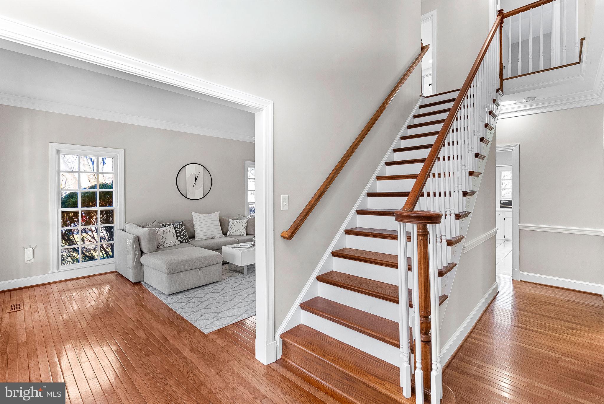 9440 Flowerden Lane Manassas, VA 20110 - Photo 3 of 66 a view of entryway and hall with wooden floor