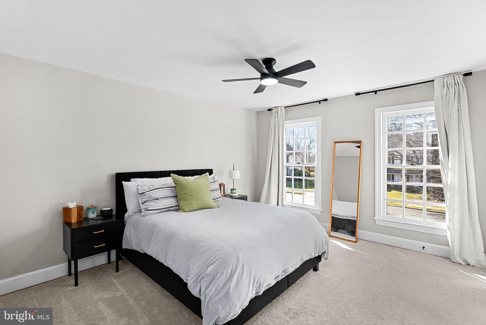 9440 Flowerden Lane Manassas, VA 20110 - Photo 37 of 66 a bedroom with a large bed and a window