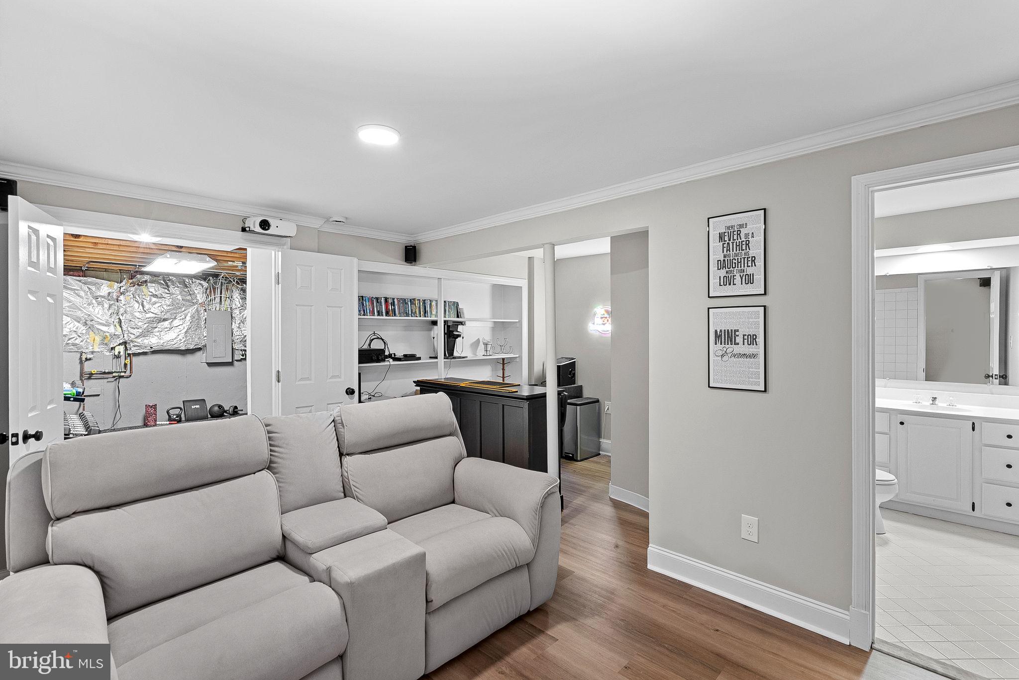 9440 Flowerden Lane Manassas, VA 20110 - Photo 50 of 66 a living room with furniture and a large window