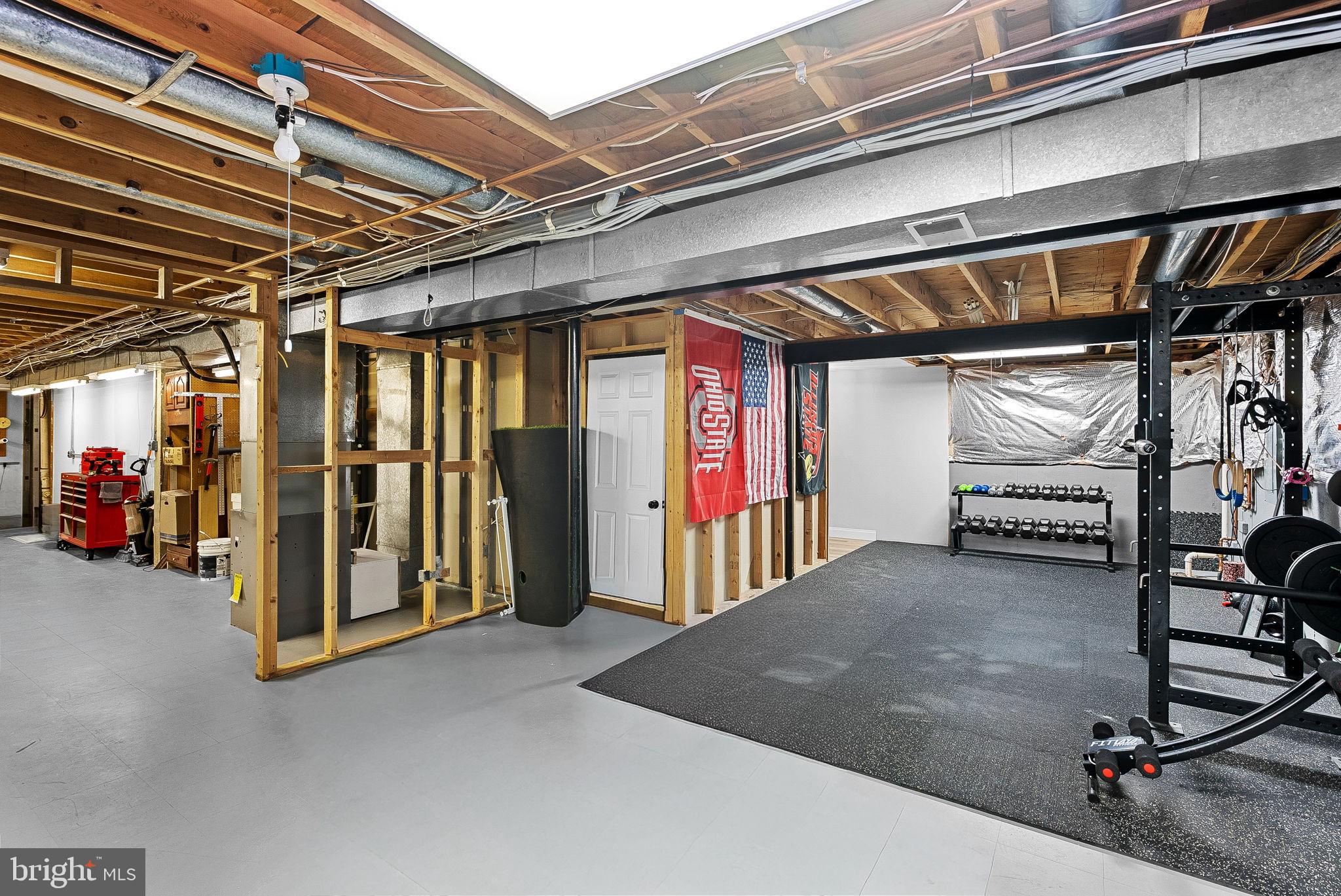 9440 Flowerden Lane Manassas, VA 20110 - Photo 54 of 66 a view of a garage with an white door