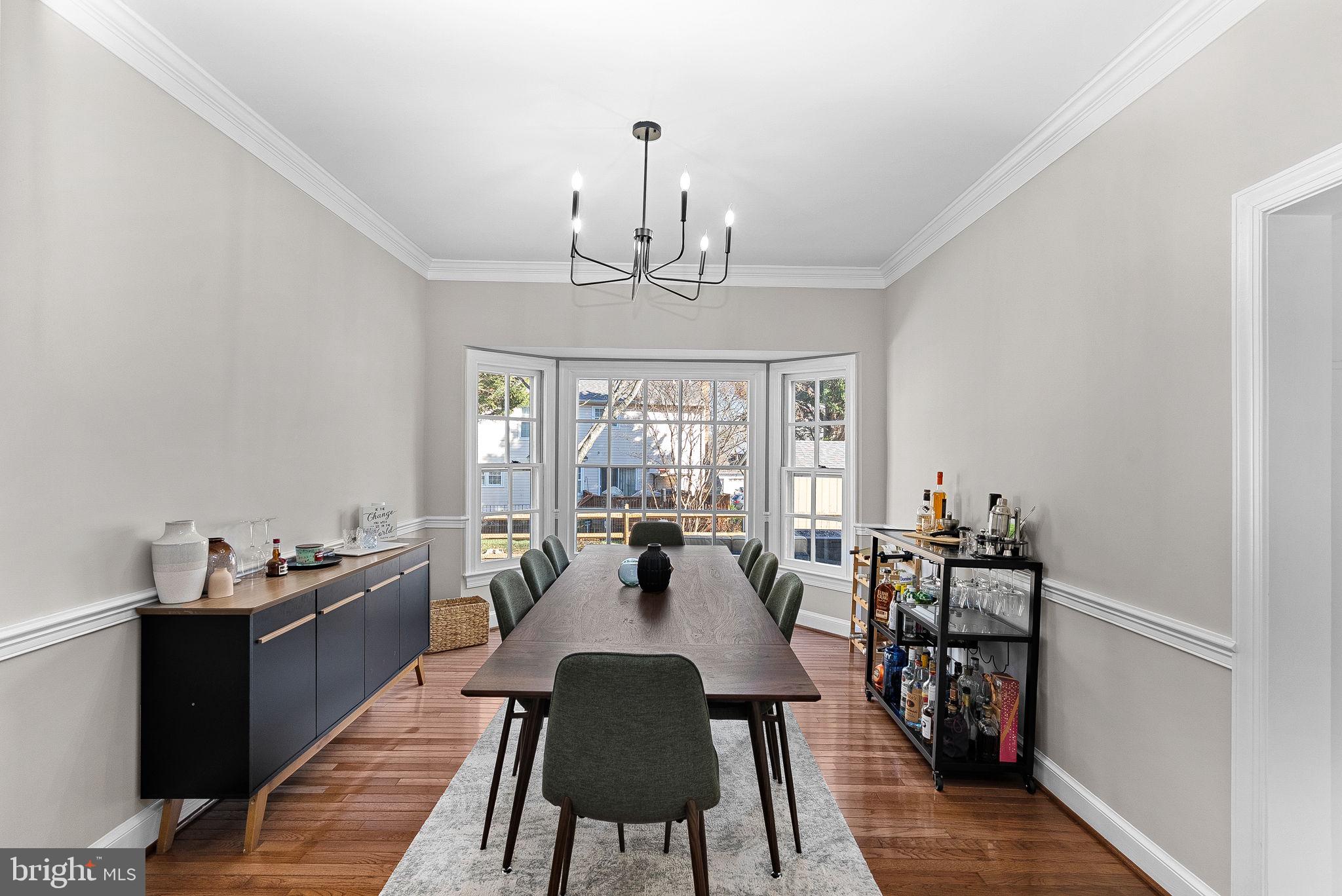 9440 Flowerden Lane Manassas, VA 20110 - Photo 6 of 66 a view of a dining room with furniture window and wooden floor