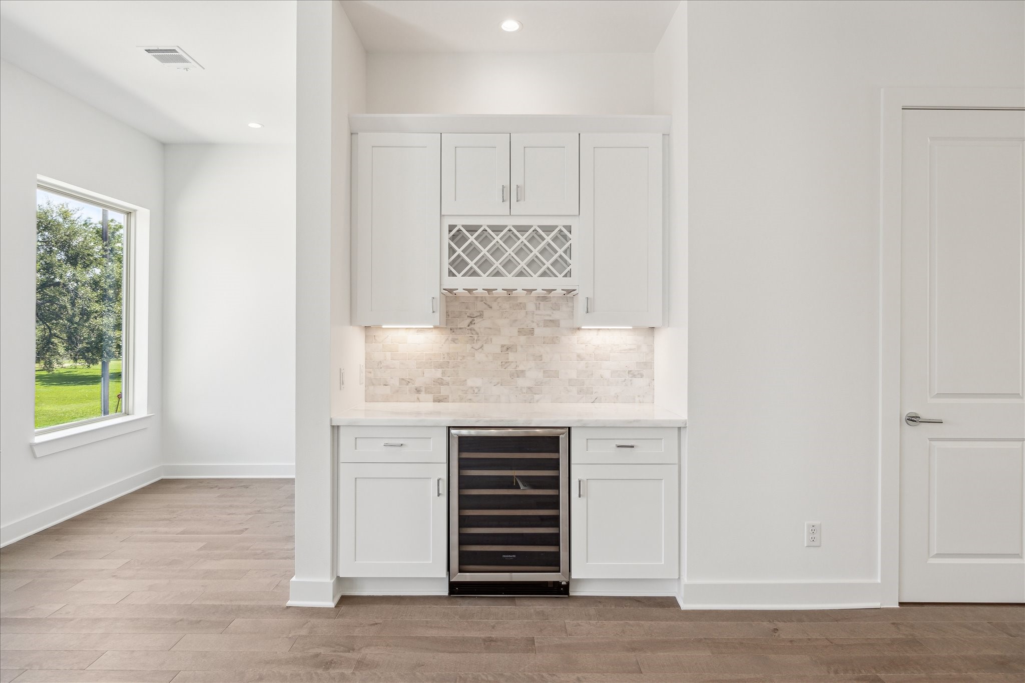 1607 Roy Street Houston, TX 77007 - Photo 20 of 50 Dry Bar with Wine Refrigerator * Marble Backsplash * Lots of Cabinets * Wine Rack.