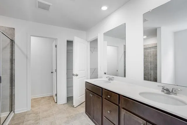 a bathroom with a shower and a sink