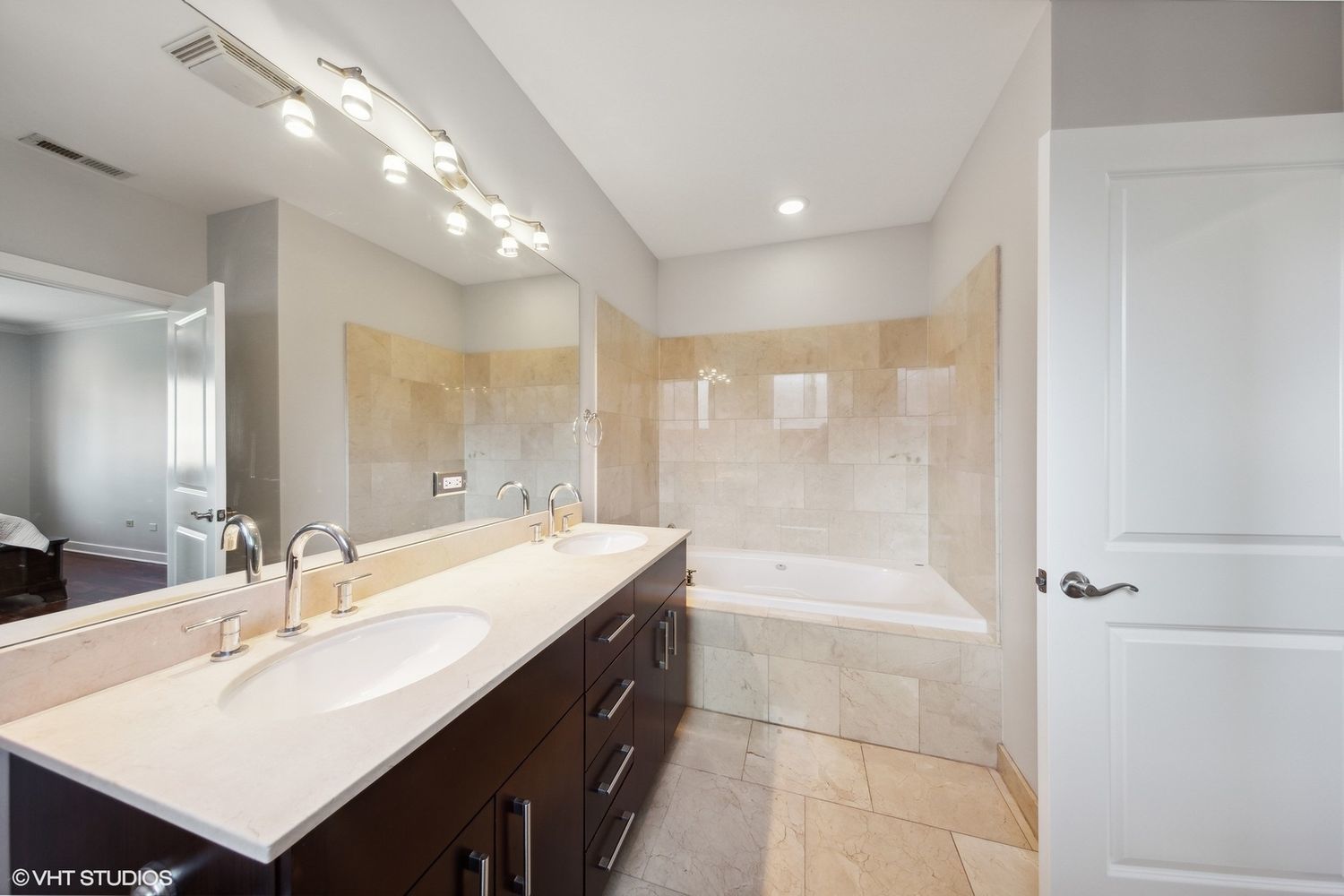 825 North Hudson Avenue, Unit 2B Chicago, IL 60610 - Photo 11 of 17 a bathroom with a bathtub double vanity sink and a shower
