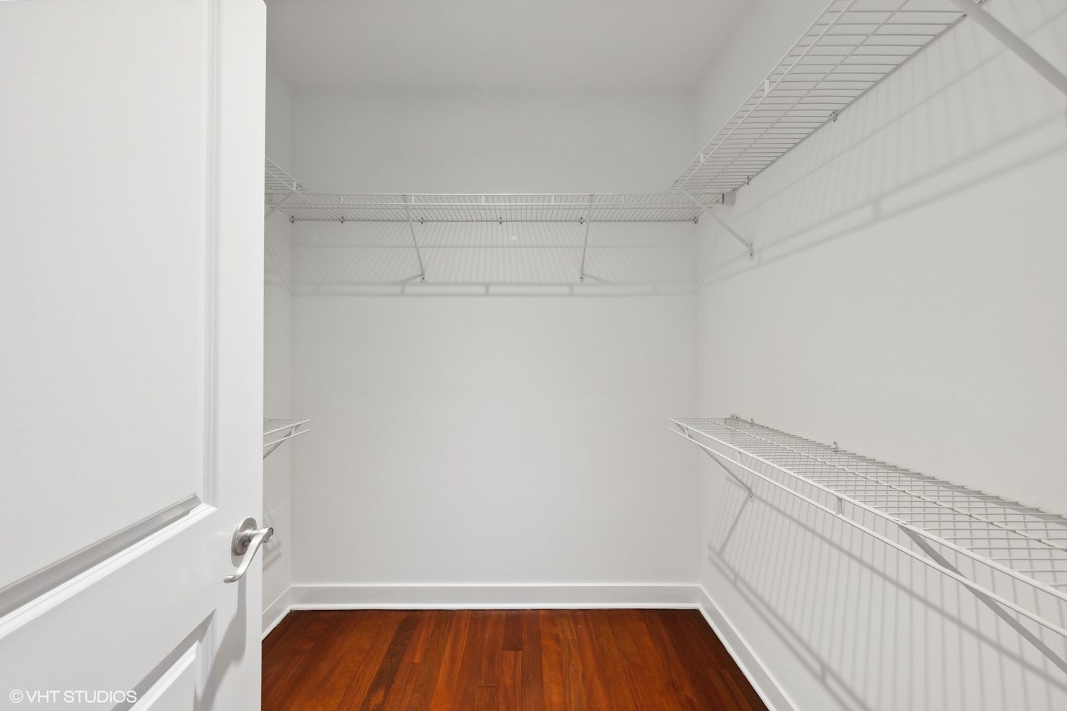 825 North Hudson Avenue, Unit 2B Chicago, IL 60610 - Photo 12 of 17 a view of walk in closet with wooden floor