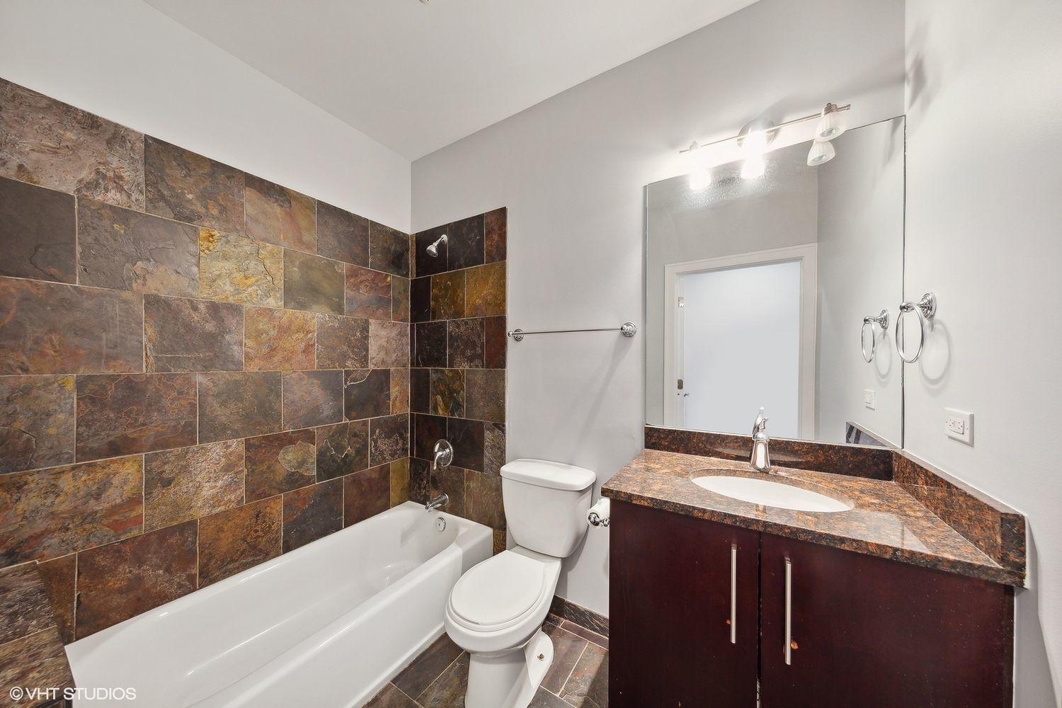 825 North Hudson Avenue, Unit 2B Chicago, IL 60610 - Photo 14 of 17 a bathroom with a granite countertop sink toilet and shower
