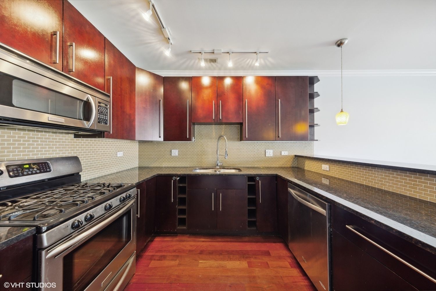 825 North Hudson Avenue, Unit 2B Chicago, IL 60610 - Photo 7 of 17 a kitchen with a sink stove and microwave