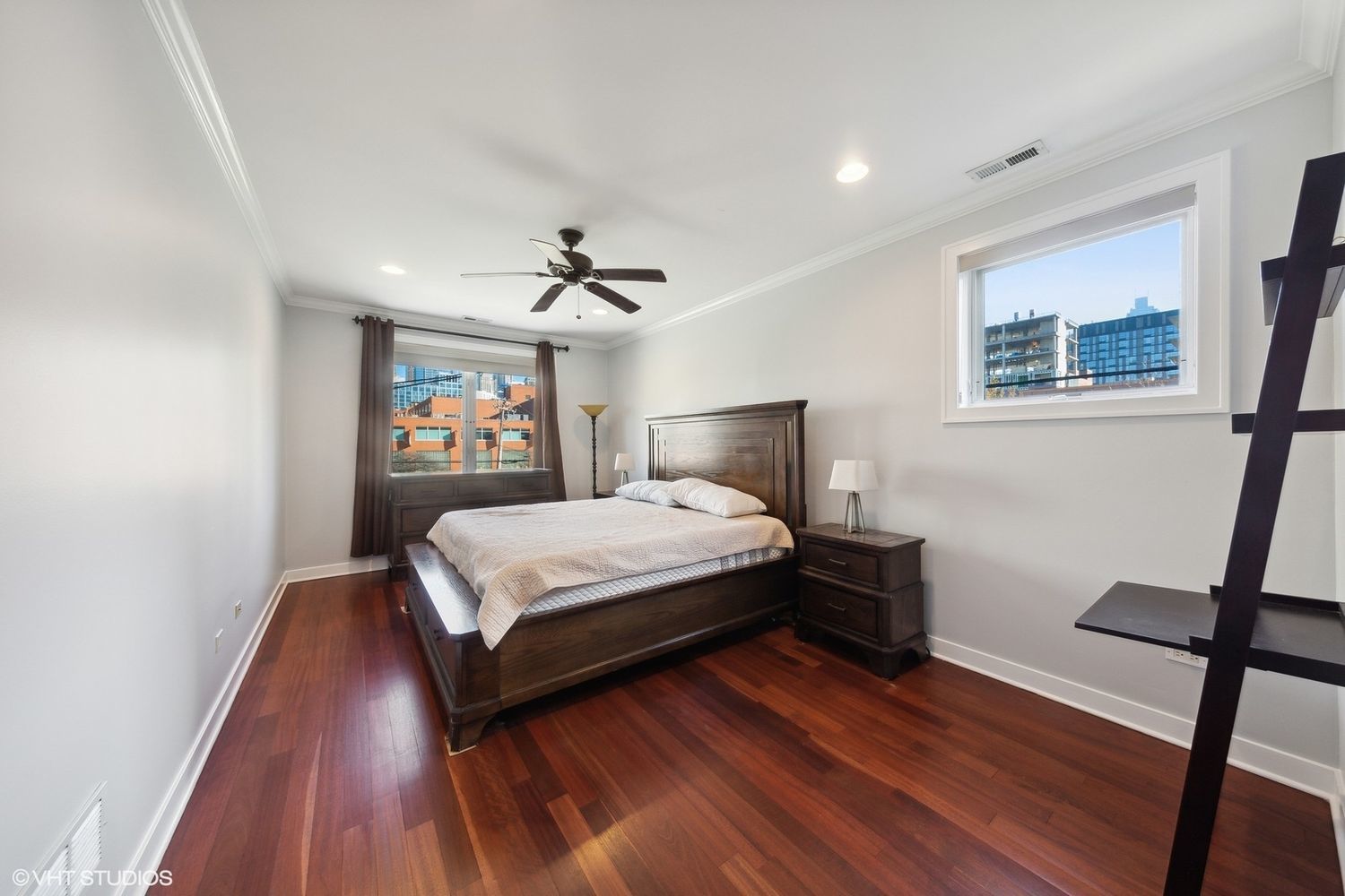 825 North Hudson Avenue, Unit 2B Chicago, IL 60610 - Photo 8 of 17 a bedroom with a bed and wooden floor