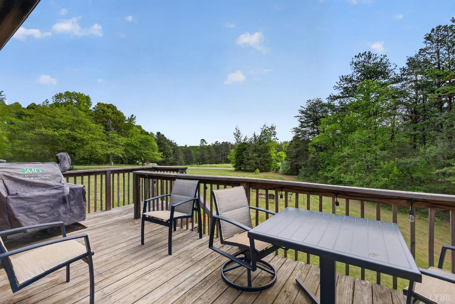 1002 Homeplace Road Rustburg, VA 24588 - Photo 12 of 48 a view of a balcony with wooden floor and outdoor seating