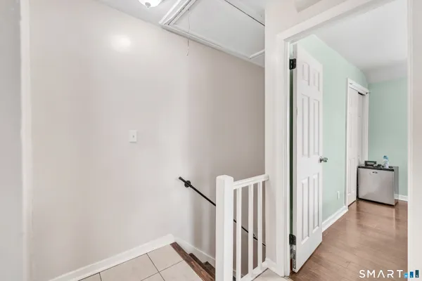 a view of a hallway with a white door