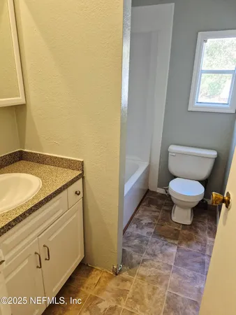 a bathroom with a sink and a toilet