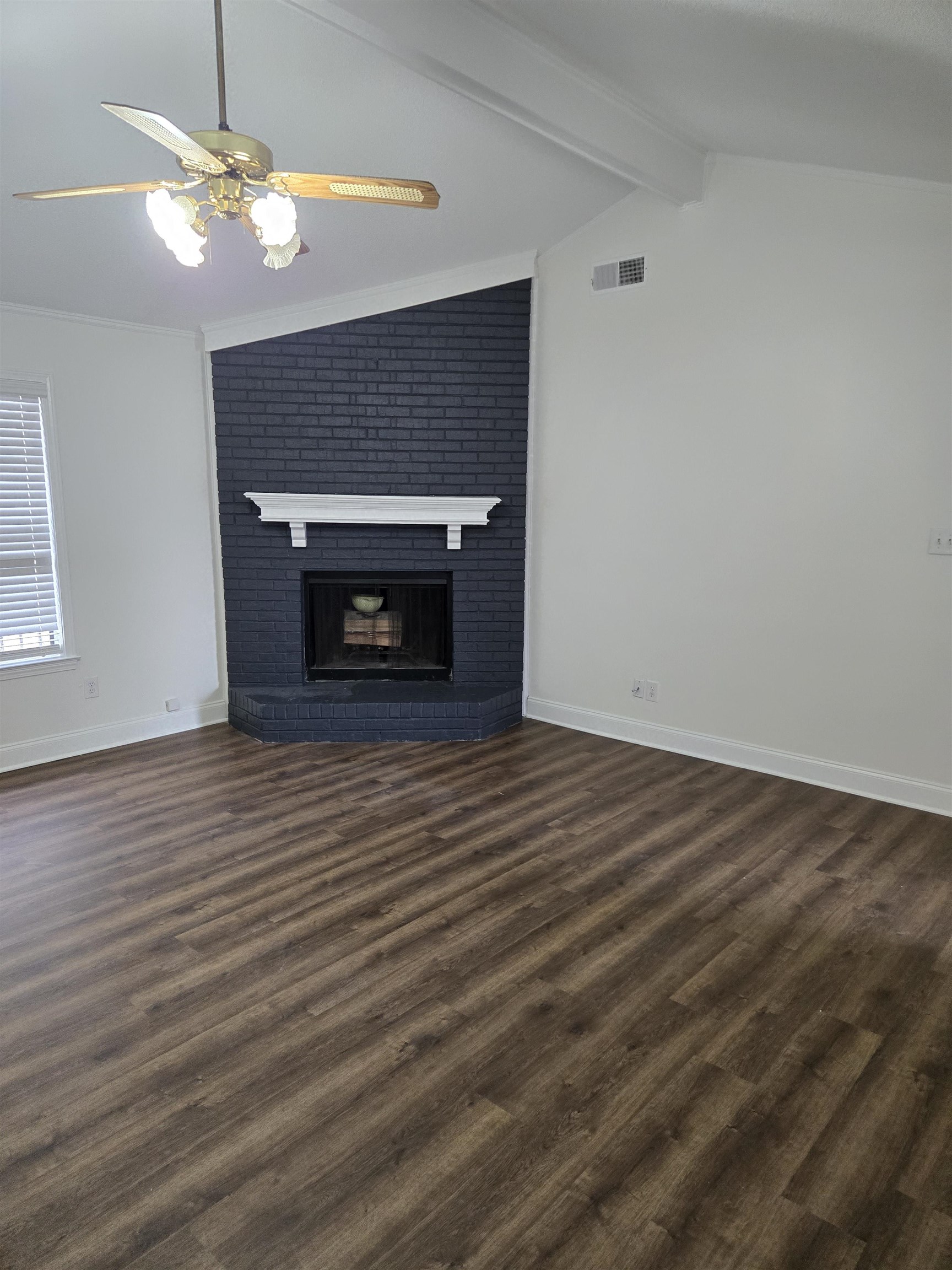 3856 Innsbrook Drive Memphis, TN 38115 - Photo 5 of 11 wooden floor fireplace and natural light in room