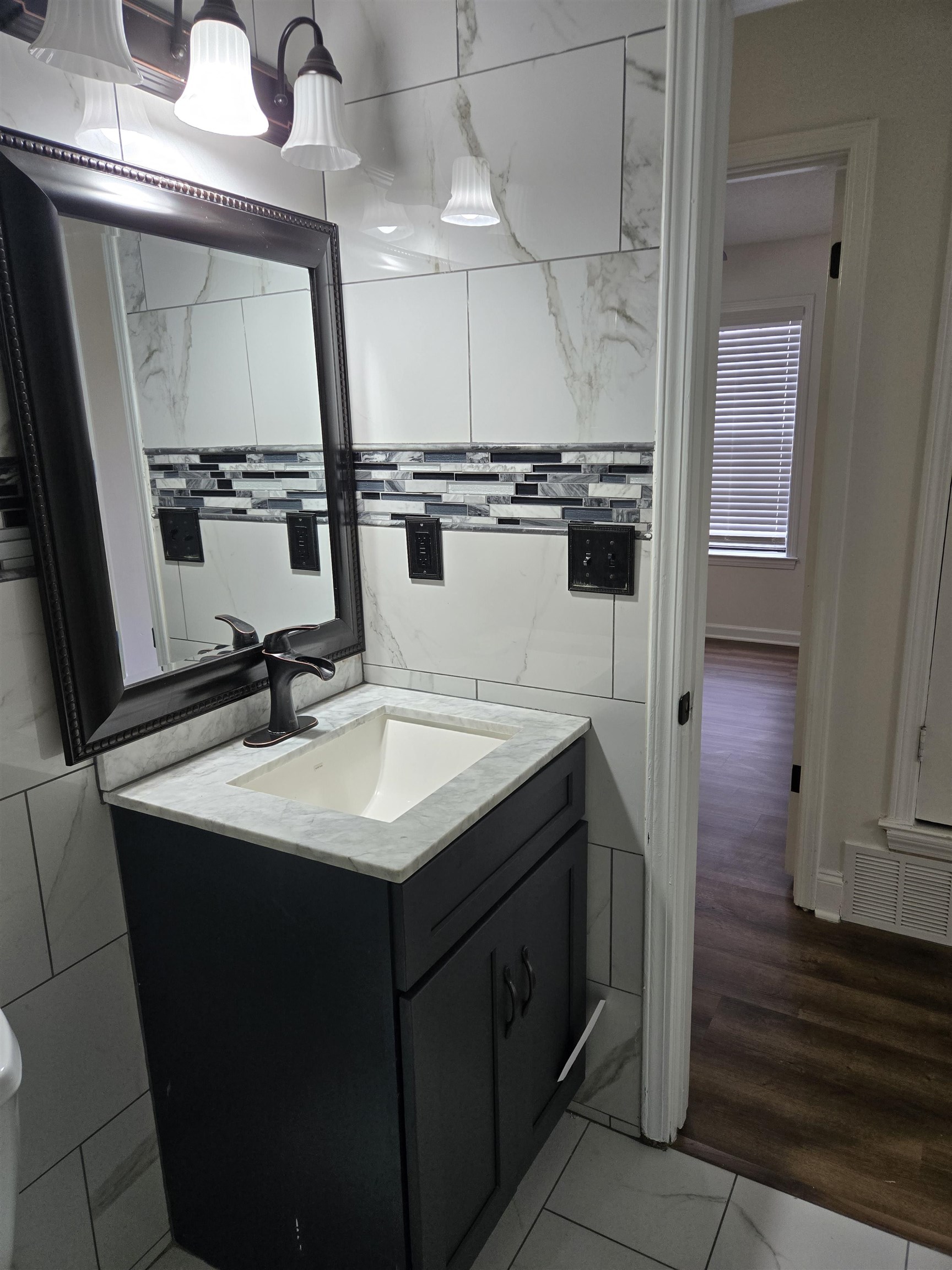 3856 Innsbrook Drive Memphis, TN 38115 - Photo 7 of 11 a kitchen with a sink a stove and cabinets