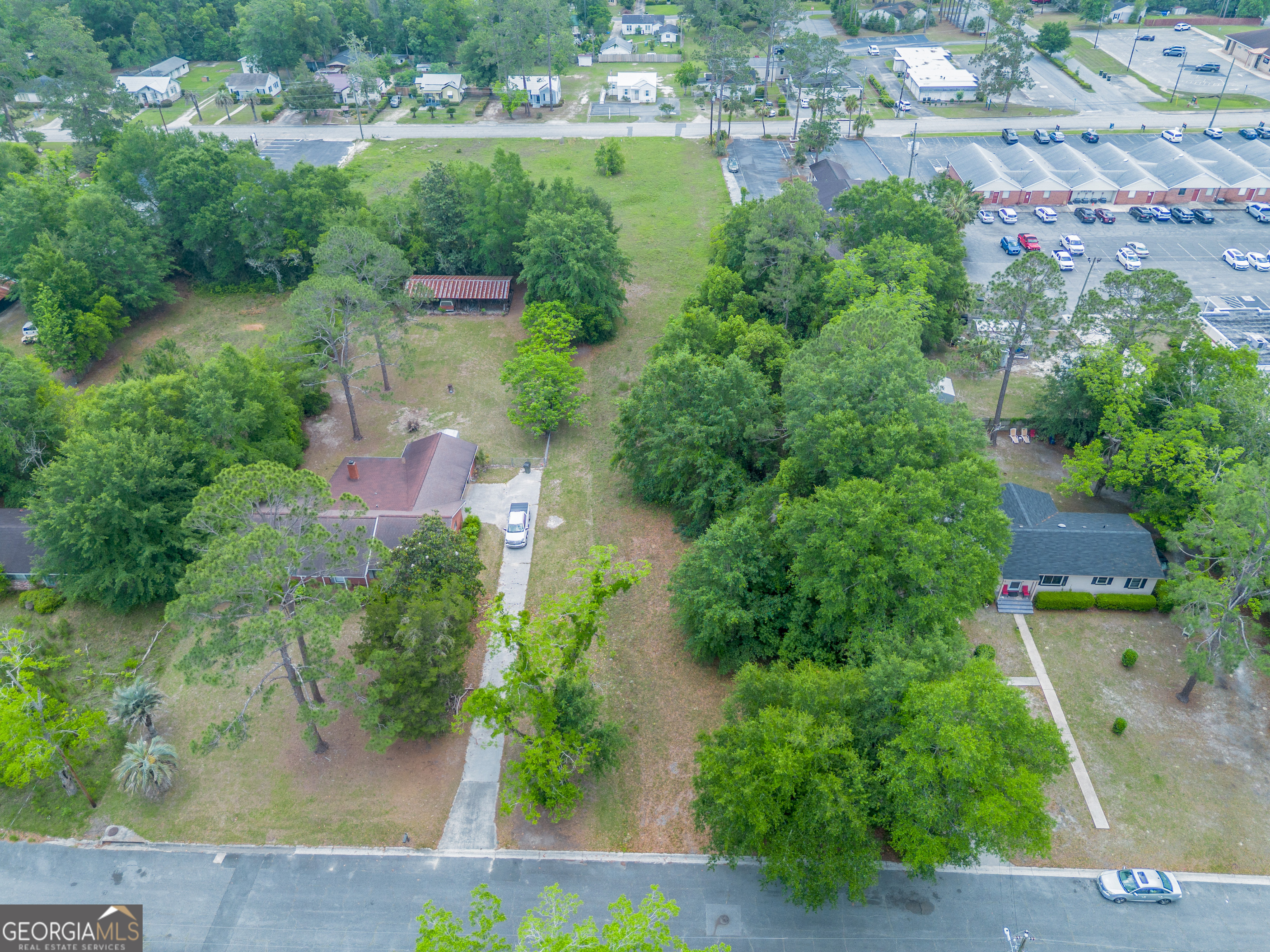 2011 Alice Street Waycross, GA 31501 - Photo 4 of 12 an aerial view of residential house with outdoor space and trees all around