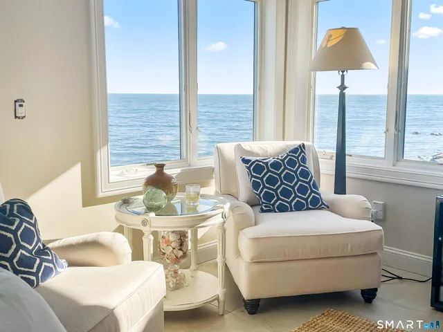 a living room with furniture and a lamp