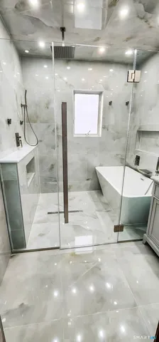 a bathroom with a shower and a mirror