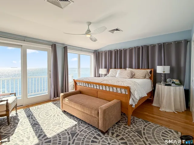 a bedroom with a large bed and a window